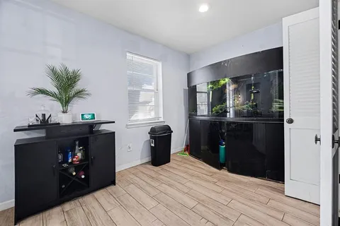 a bedroom with a bed and window