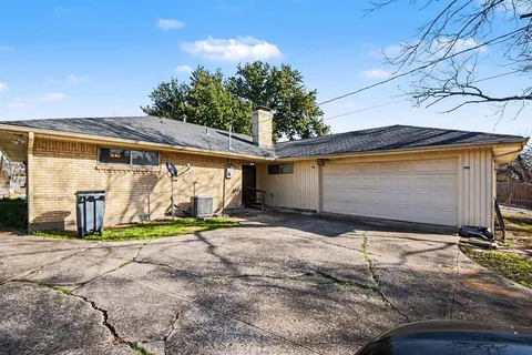 a view of a house with pool and a yard