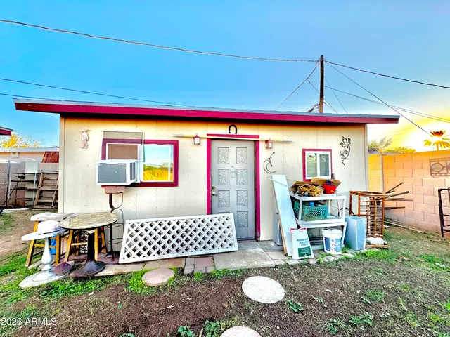 a view of a balcony with cars parked