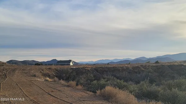 a view of a yard with mountain view