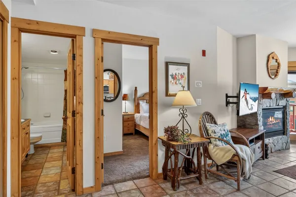 a view of a livingroom with furniture and front door