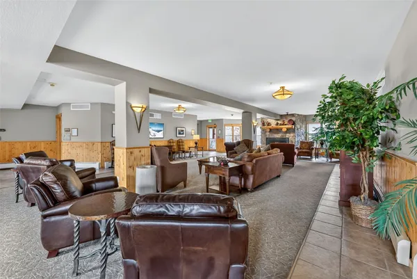 a living room with furniture and a table