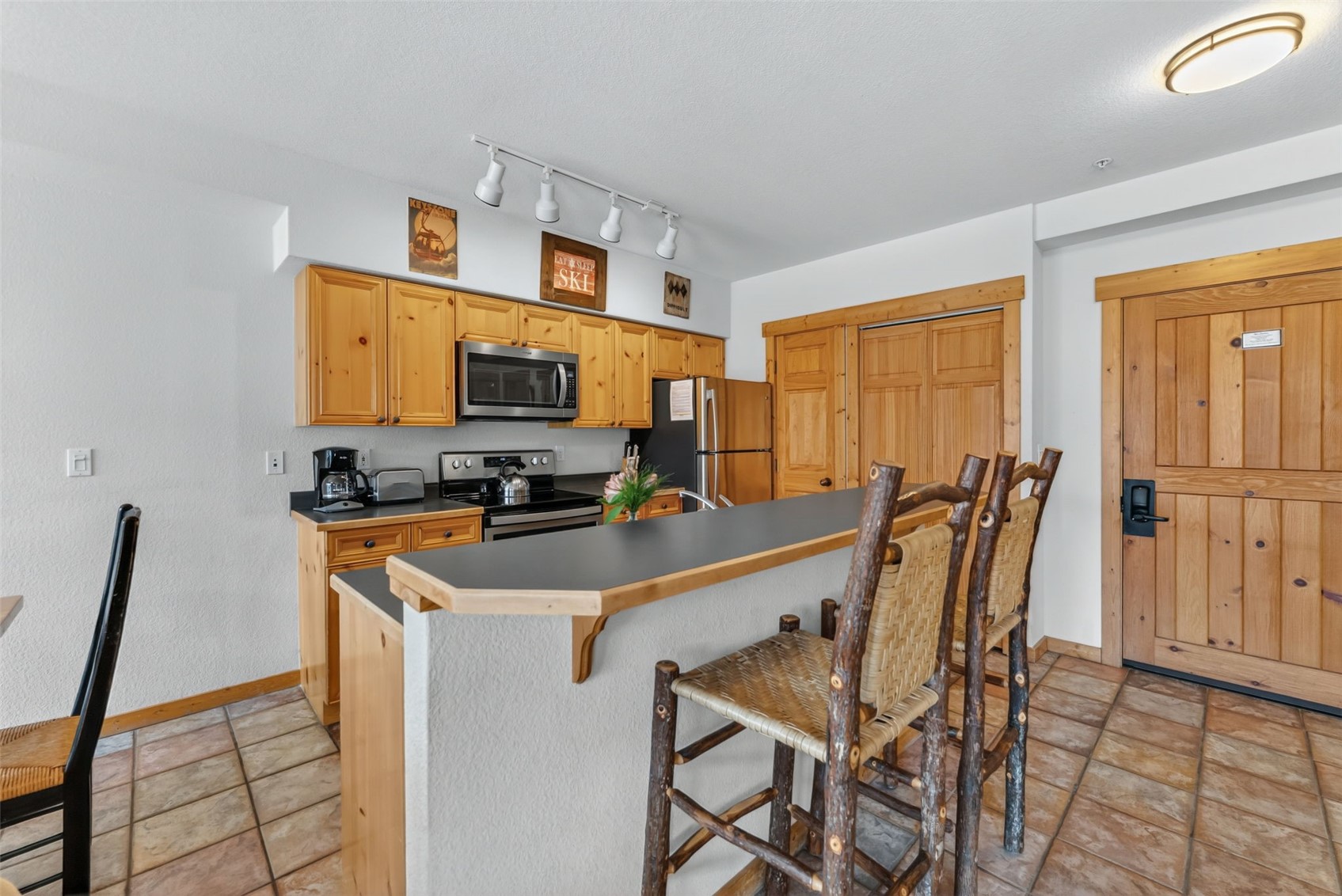 22784 Highway 6, Unit 2620 Keystone, CO 80435 - Photo 7 of 41 Closets off the kitchen are washer/dryer and large owner's closet.