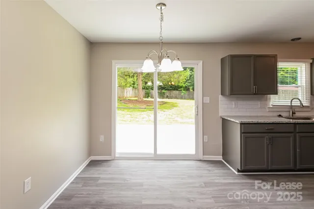 a view of a kitchen with a sink and a window