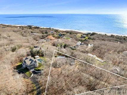 a view of house with backyard