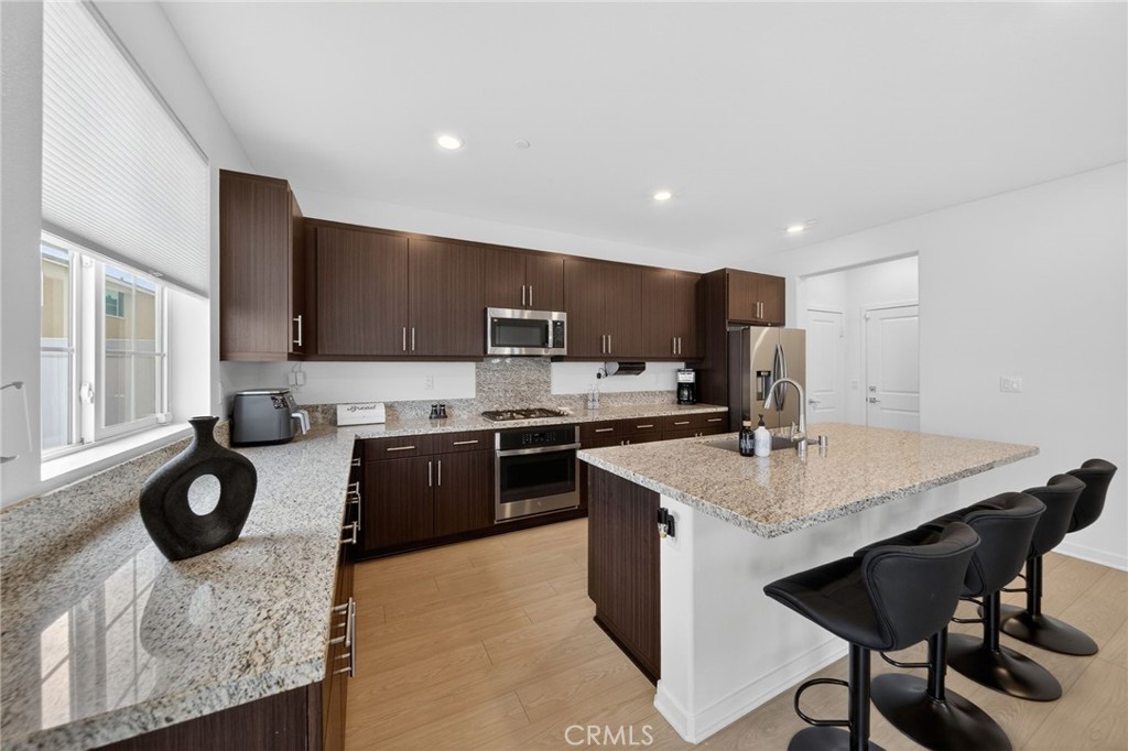 587 Holston Street Rialto, CA 92377 - Photo 6 of 44 Kitchen with Island Seating