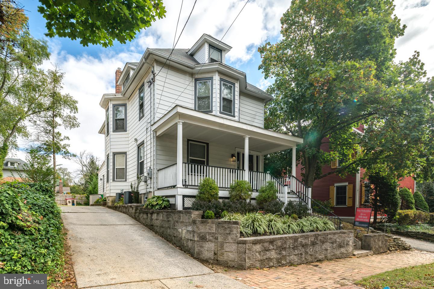 123 Potter Street Haddonfield, NJ 08033 - Photo 1 of 31 a front view of a house with a yard and potted plants