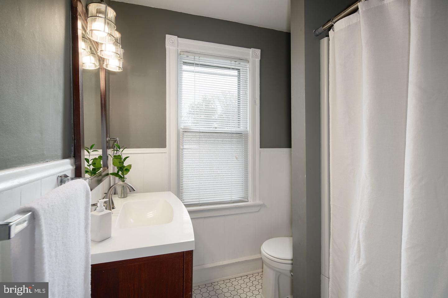 123 Potter Street Haddonfield, NJ 08033 - Photo 17 of 31 a bathroom with a toilet sink and mirror