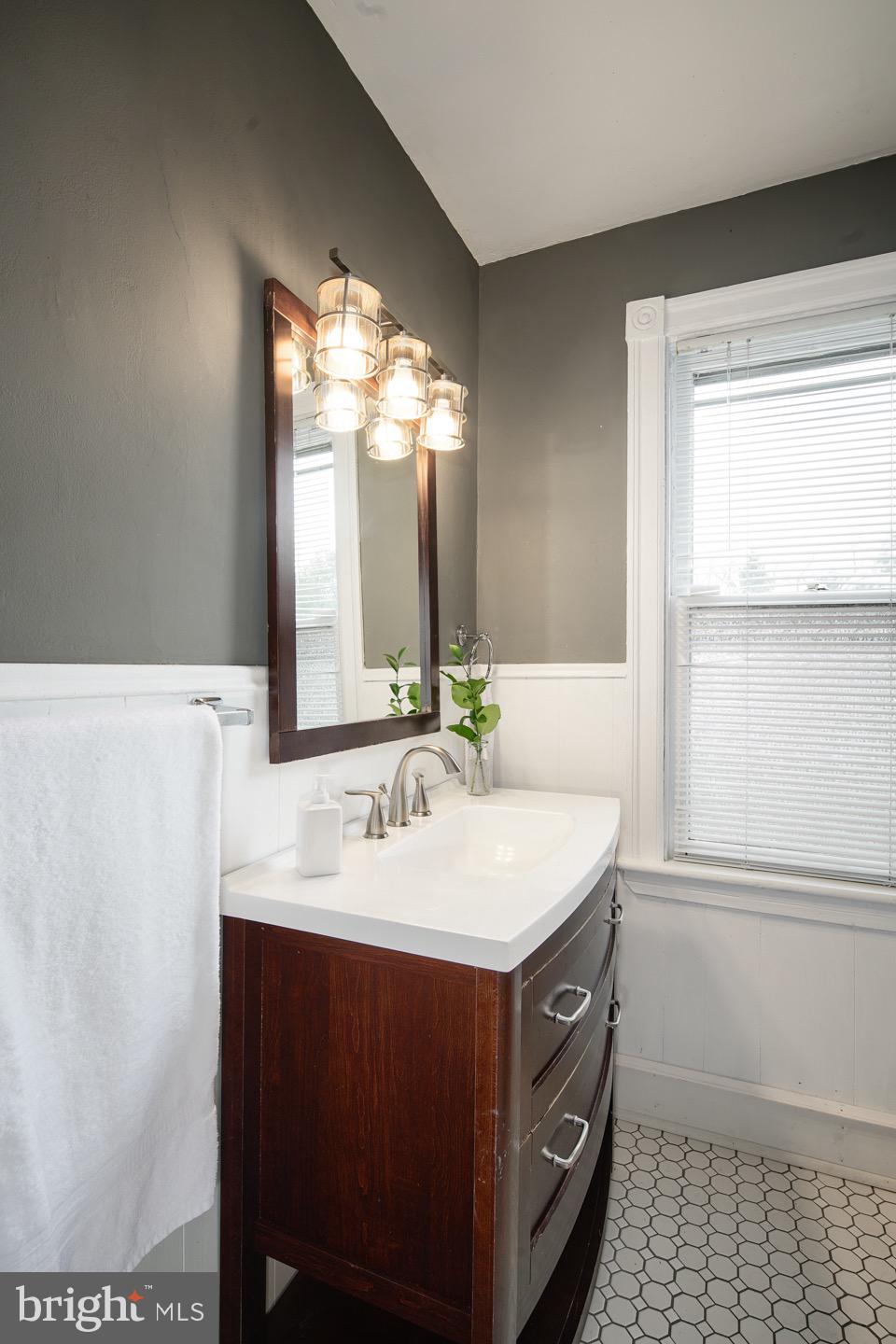 123 Potter Street Haddonfield, NJ 08033 - Photo 18 of 31 a bathroom with a sink and a mirror