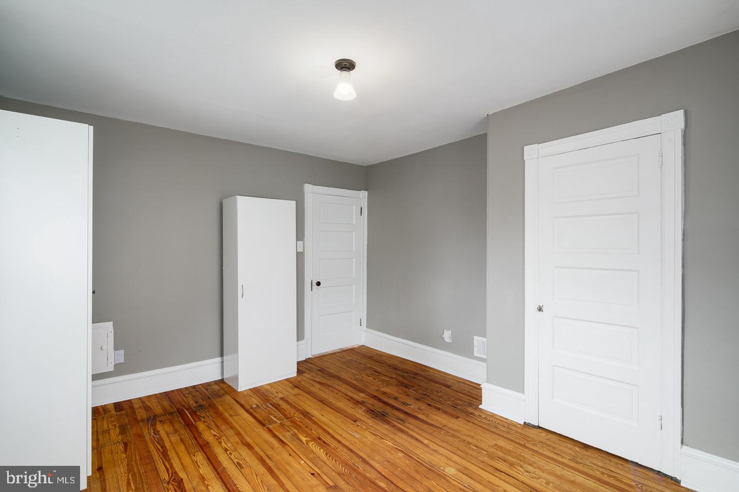 123 Potter Street Haddonfield, NJ 08033 - Photo 20 of 31 a bedroom with a bed and wooden floor