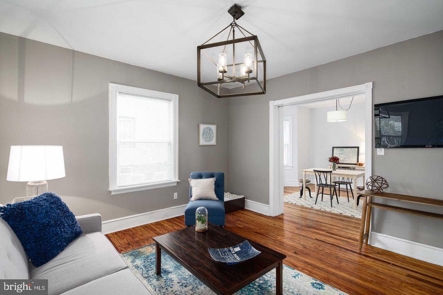 123 Potter Street Haddonfield, NJ 08033 - Photo 5 of 31 a living room with furniture a dining table and a window