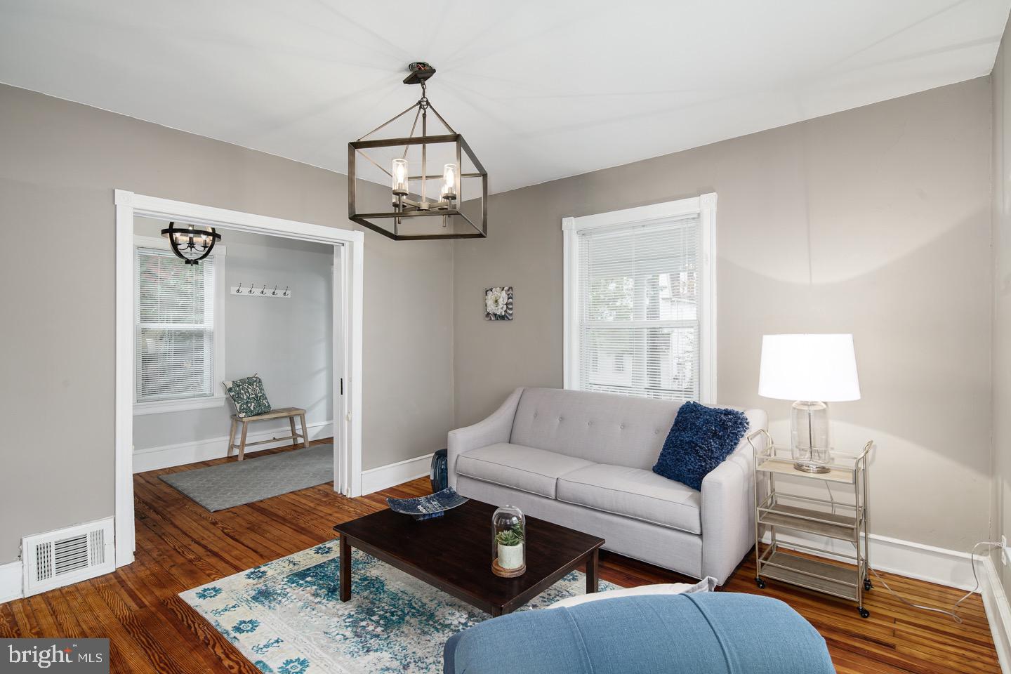 123 Potter Street Haddonfield, NJ 08033 - Photo 6 of 31 a living room with furniture wooden floor and a table