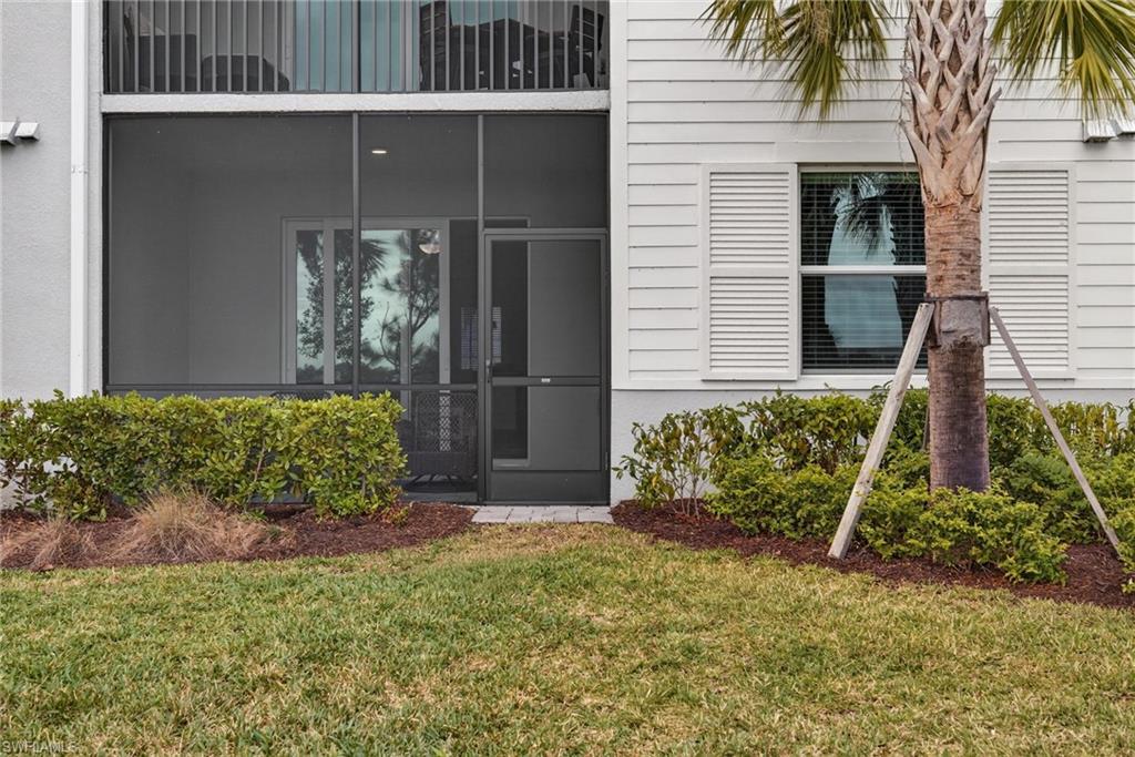 43985 Boardwalk Loop, Unit 2115 Punta Gorda, FL 33982 - Photo 20 of 28 a front view of a house having yard