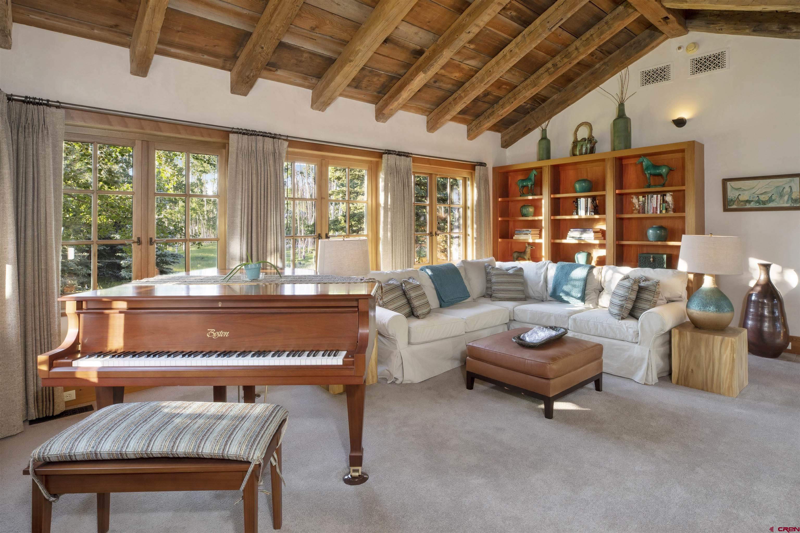 8121 Preserve Drive Telluride, CO 81435 - Photo 13 of 35 a living room with furniture a rug potted plant and a large window
