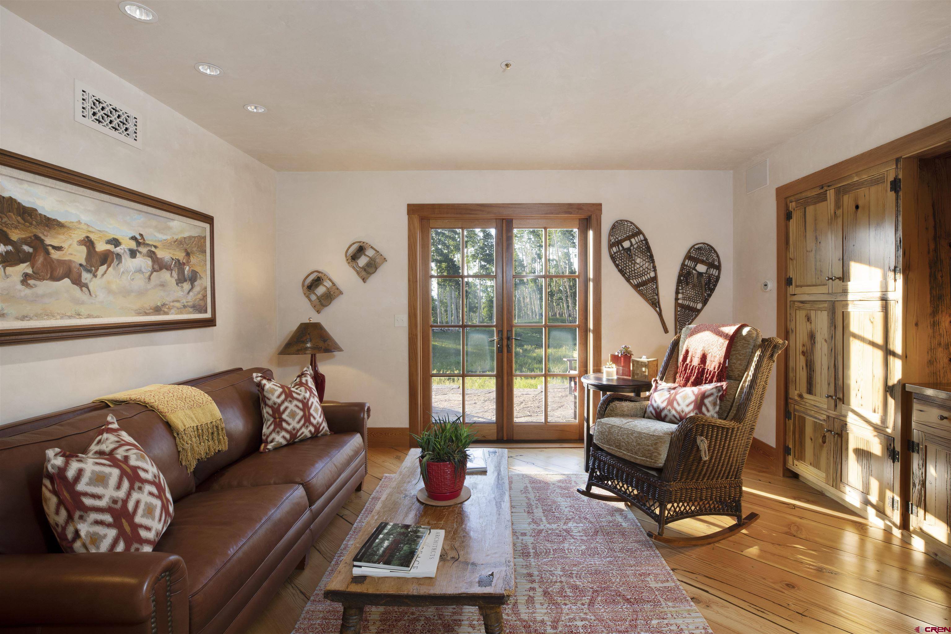 8121 Preserve Drive Telluride, CO 81435 - Photo 15 of 35 a living room with furniture or couch and a floor to ceiling window