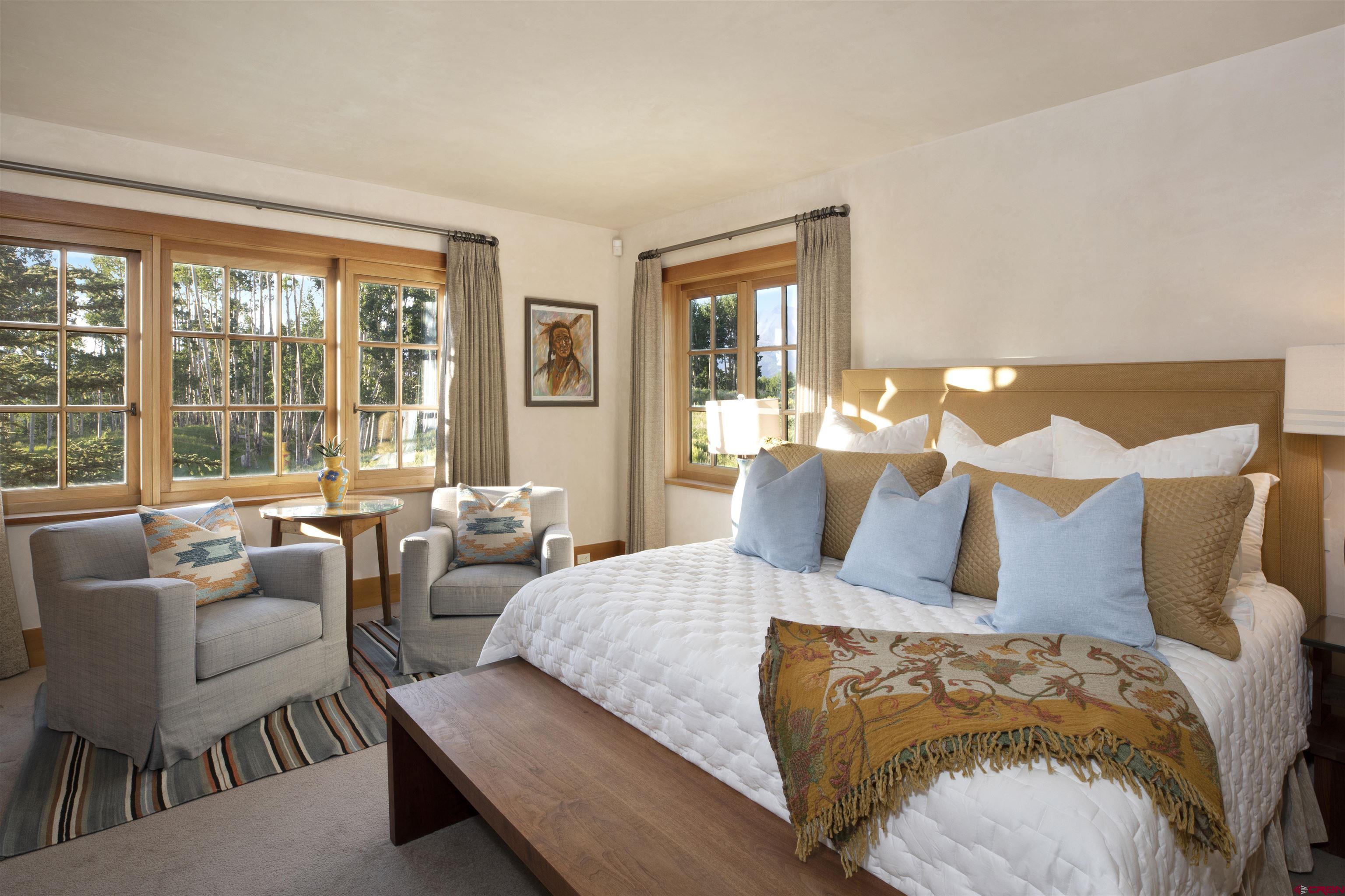 8121 Preserve Drive Telluride, CO 81435 - Photo 16 of 35 a bedroom with bed and a large window