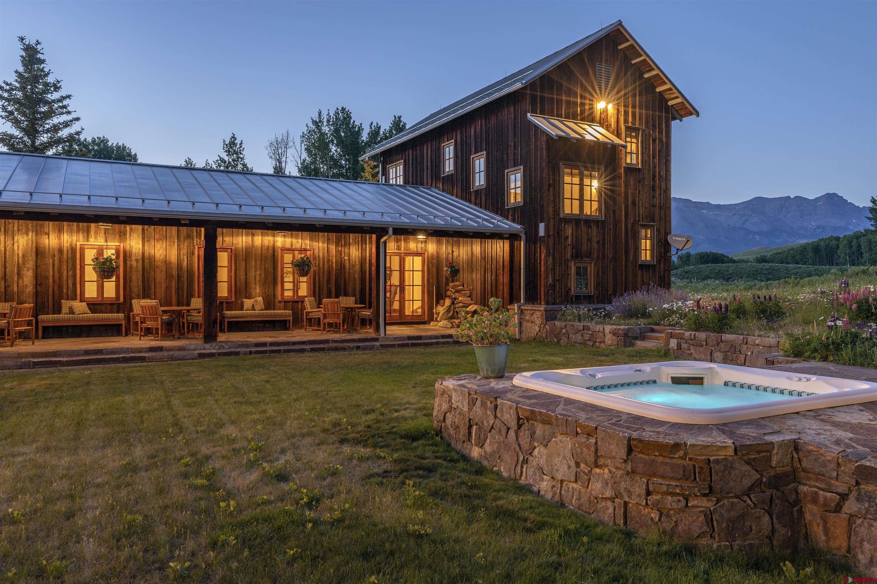 8121 Preserve Drive Telluride, CO 81435 - Photo 19 of 35 a swimming pool with outdoor seating and yard
