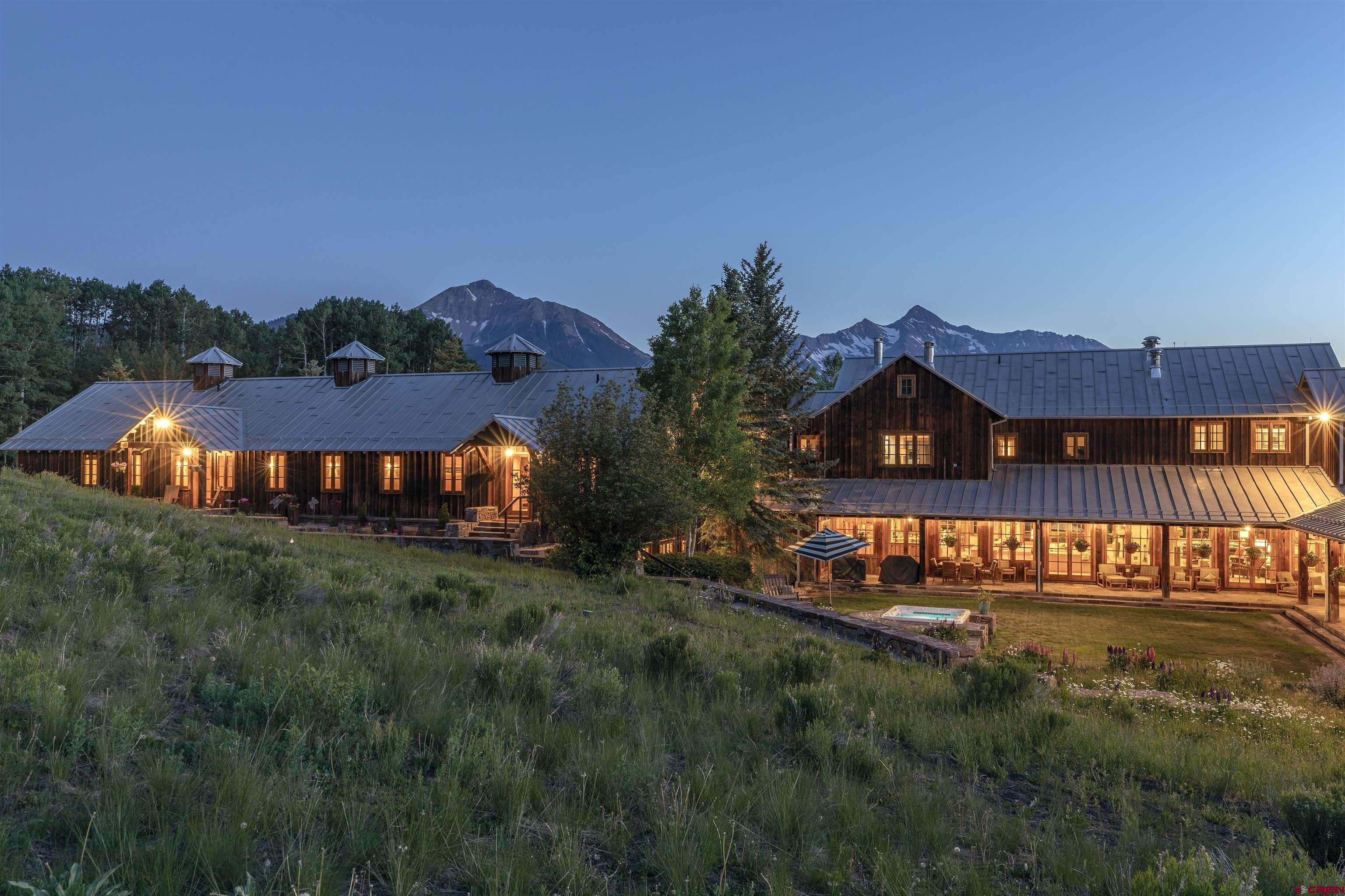 8121 Preserve Drive Telluride, CO 81435 - Photo 20 of 35 a view of a big house with a big yard and potted plants