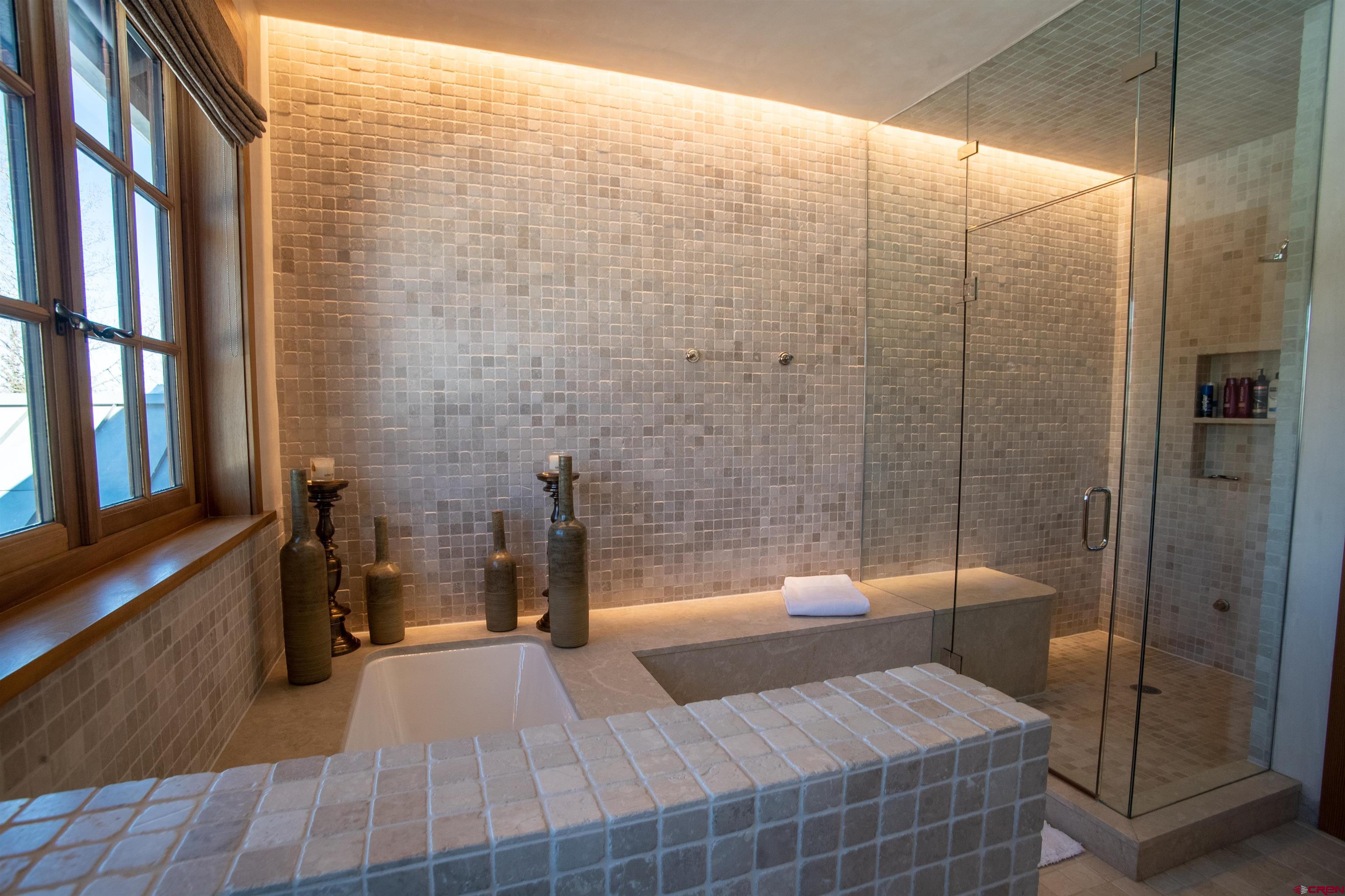 8121 Preserve Drive Telluride, CO 81435 - Photo 24 of 35 a bathroom with a bathtub and shower