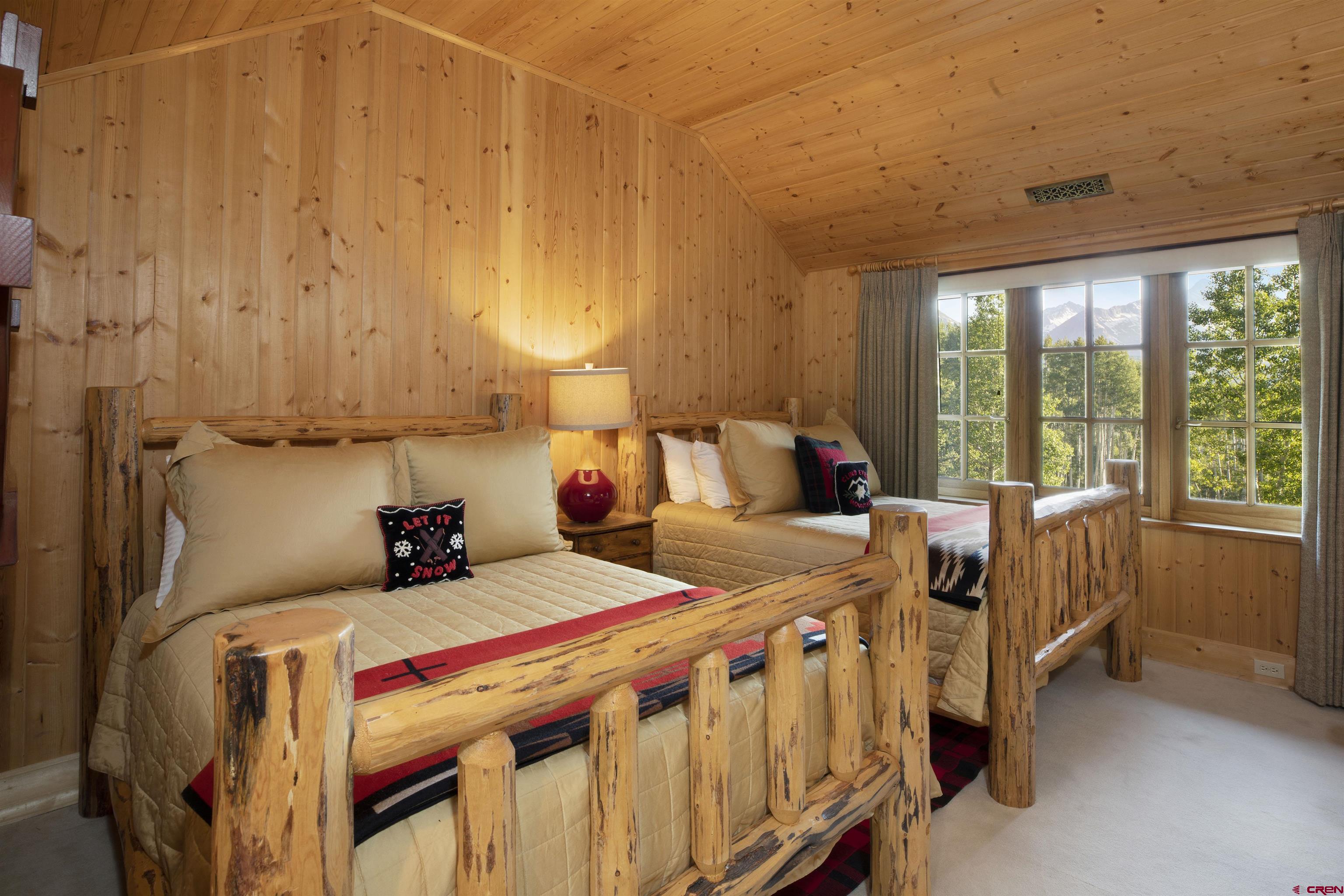 8121 Preserve Drive Telluride, CO 81435 - Photo 28 of 35 a bedroom with a bed and a window