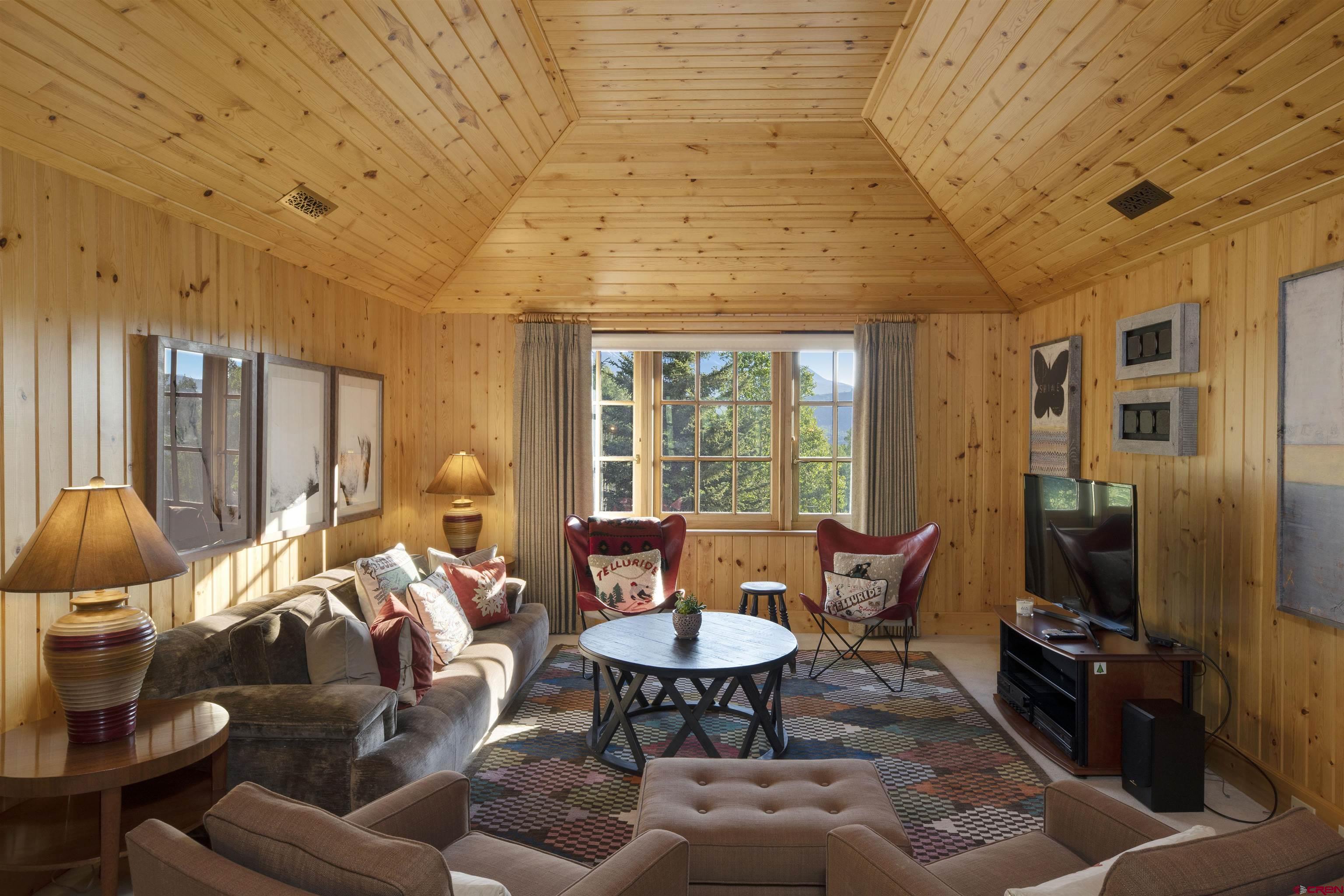 8121 Preserve Drive Telluride, CO 81435 - Photo 30 of 35 a living room with furniture a rug and a flat screen tv