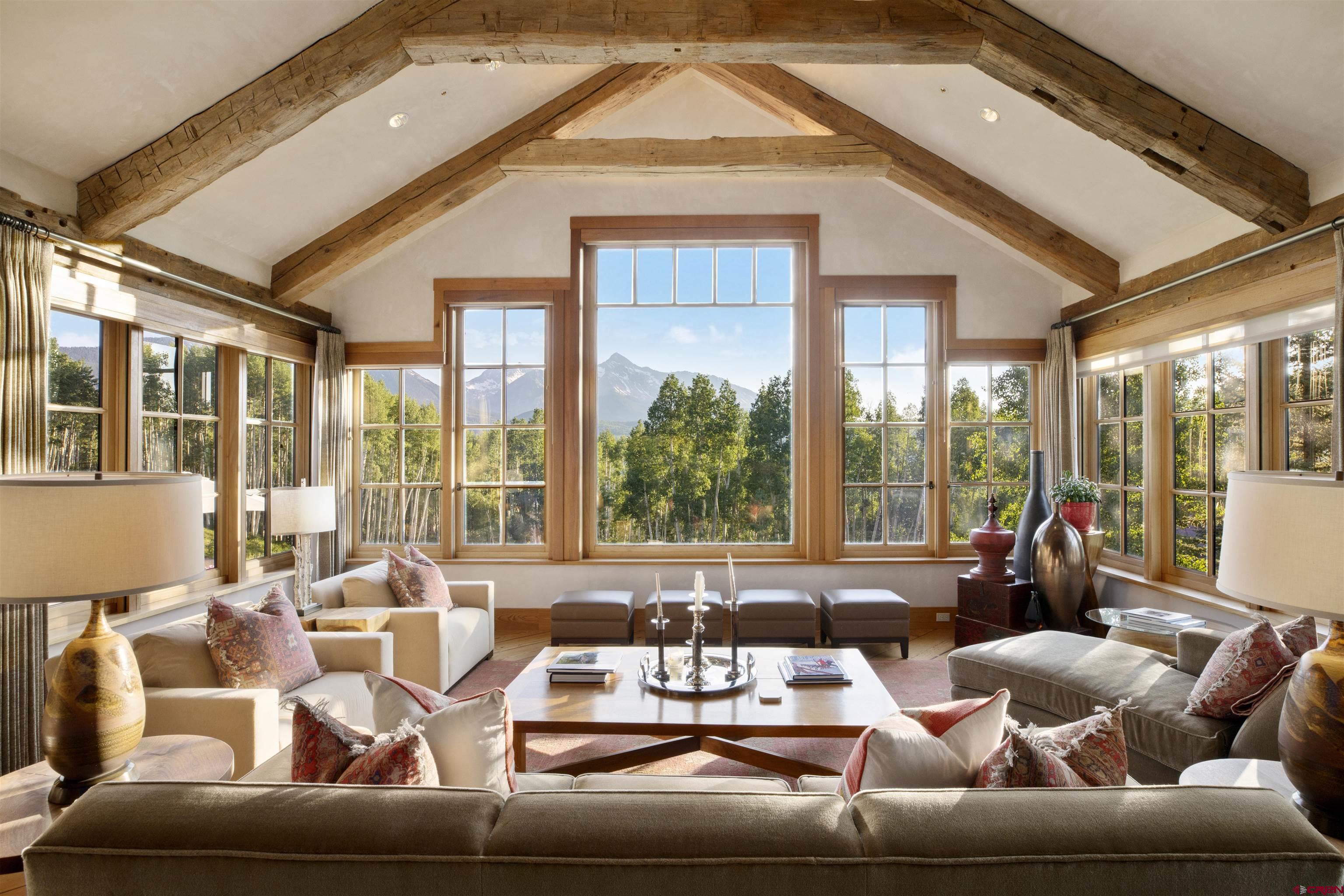 8121 Preserve Drive Telluride, CO 81435 - Photo 5 of 35 a living room with furniture and floor to ceiling windows