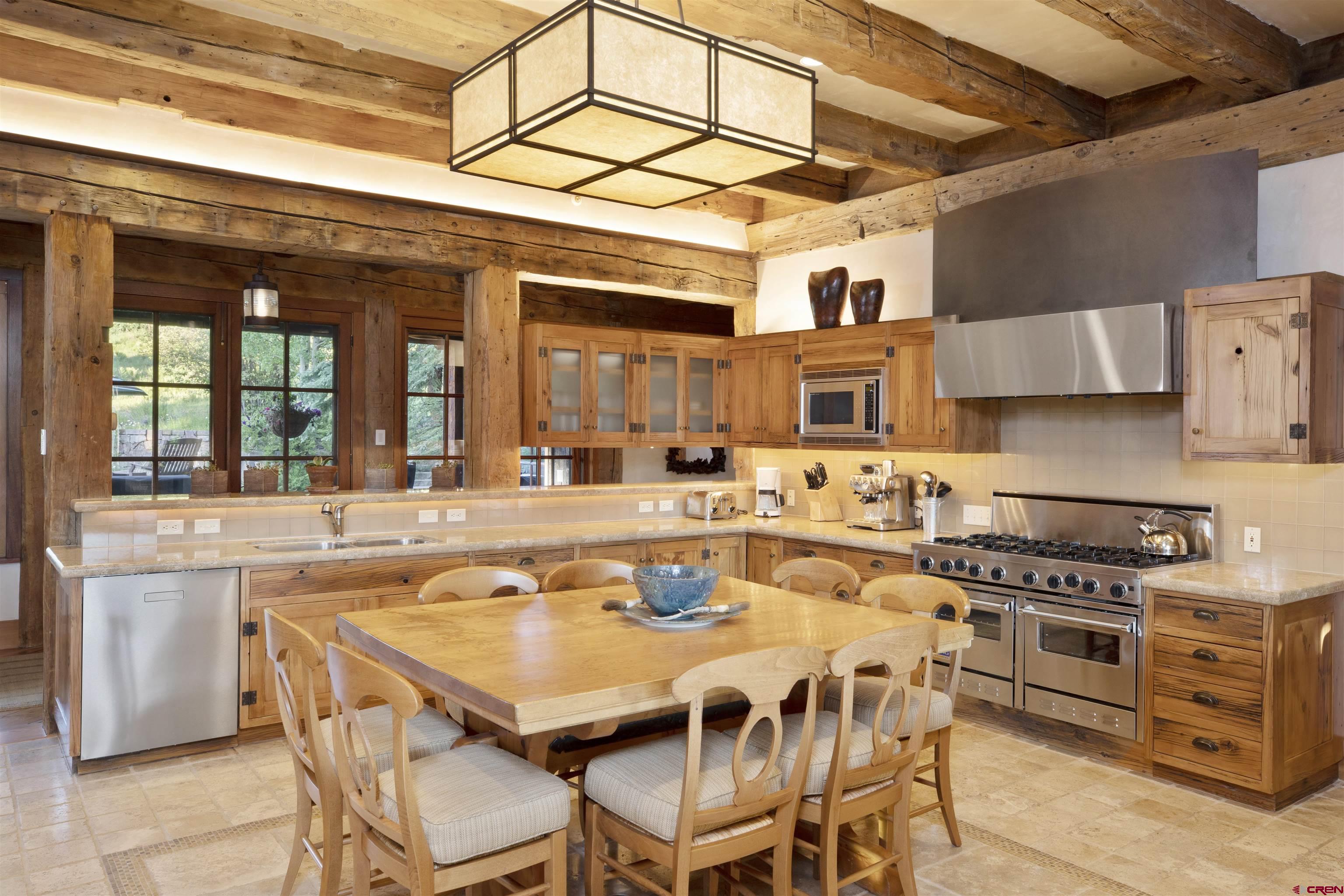 8121 Preserve Drive Telluride, CO 81435 - Photo 10 of 35 a kitchen with stainless steel appliances granite countertop a stove and cabinets