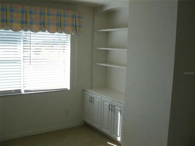 a view of a room that has a window in it