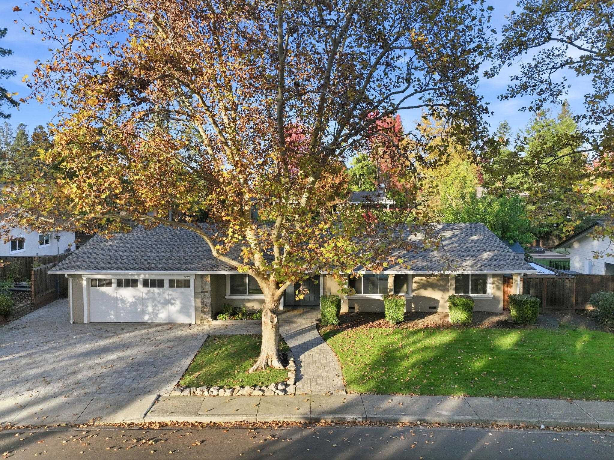 a front view of house with yard and green space