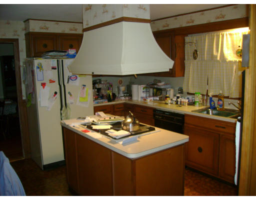 152 Savoy Avenue Springfield, MA 01104 - Photo 3 of 11 a kitchen with a sink a stove and a refrigerator