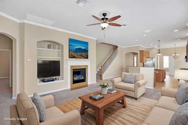 a living room with furniture fireplace and a flat screen tv