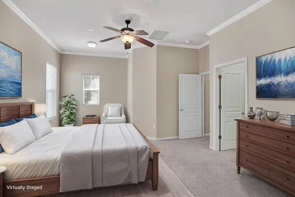 a bedroom with a bed and a dresser