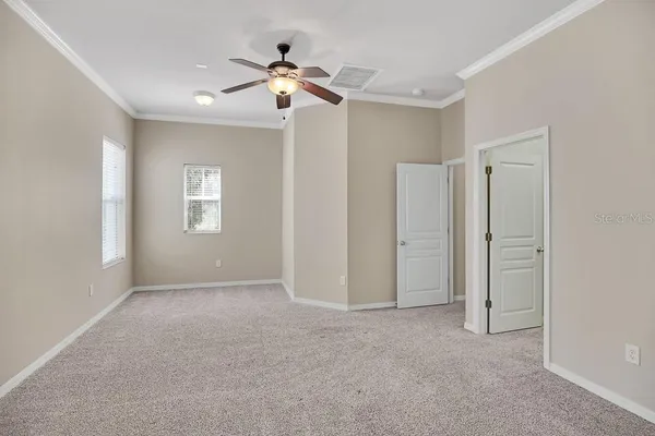 a view of an empty room with a window