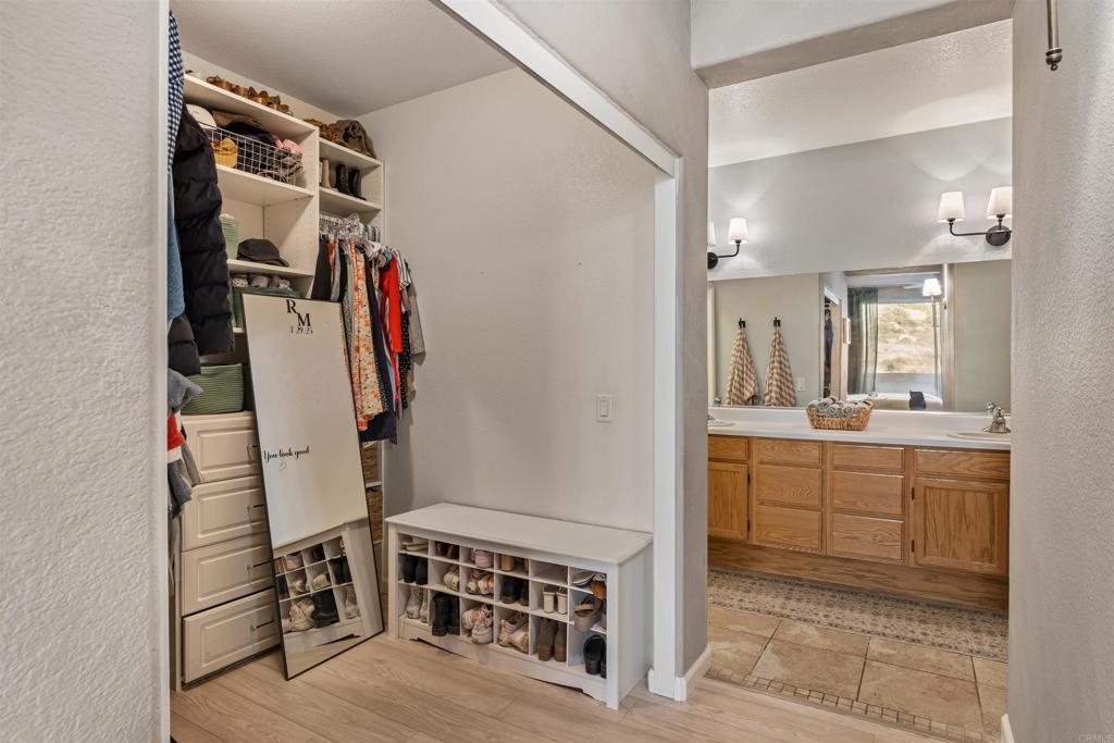 3183 Dehesa Road, Unit 19 El Cajon, CA 92019 - Photo 11 of 26 a view of walk in closet with clothes and shoes
