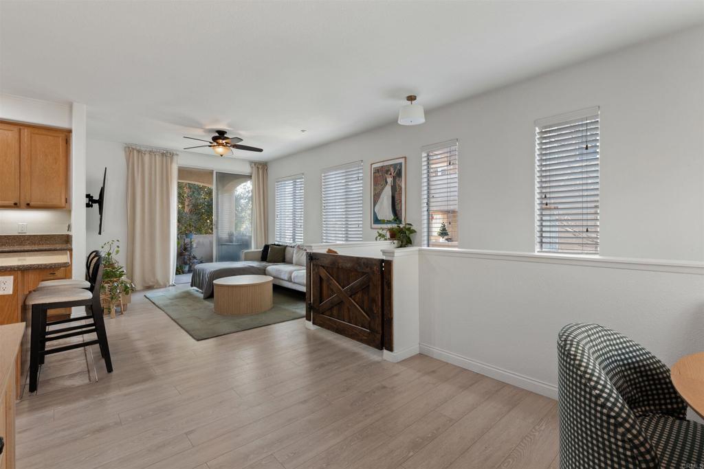 3183 Dehesa Road, Unit 19 El Cajon, CA 92019 - Photo 2 of 26 a living room with furniture and a wooden floor