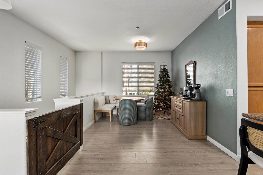 3183 Dehesa Road, Unit 19 El Cajon, CA 92019 - Photo 5 of 26 a living room with furniture and wooden floor