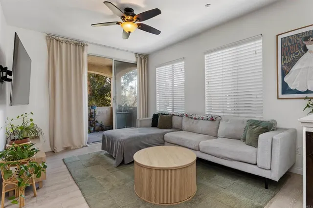 a living room with furniture and a large window