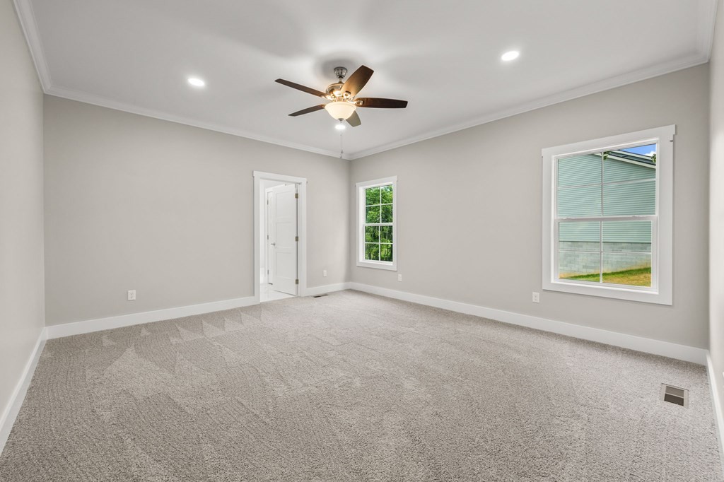 4595 Window Cliff Road Baxter, TN 38544 - Photo 13 of 30 an empty room with windows and fan