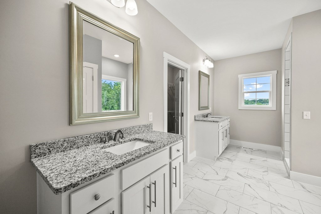 4595 Window Cliff Road Baxter, TN 38544 - Photo 15 of 30 a bathroom with a granite countertop sink and a mirror
