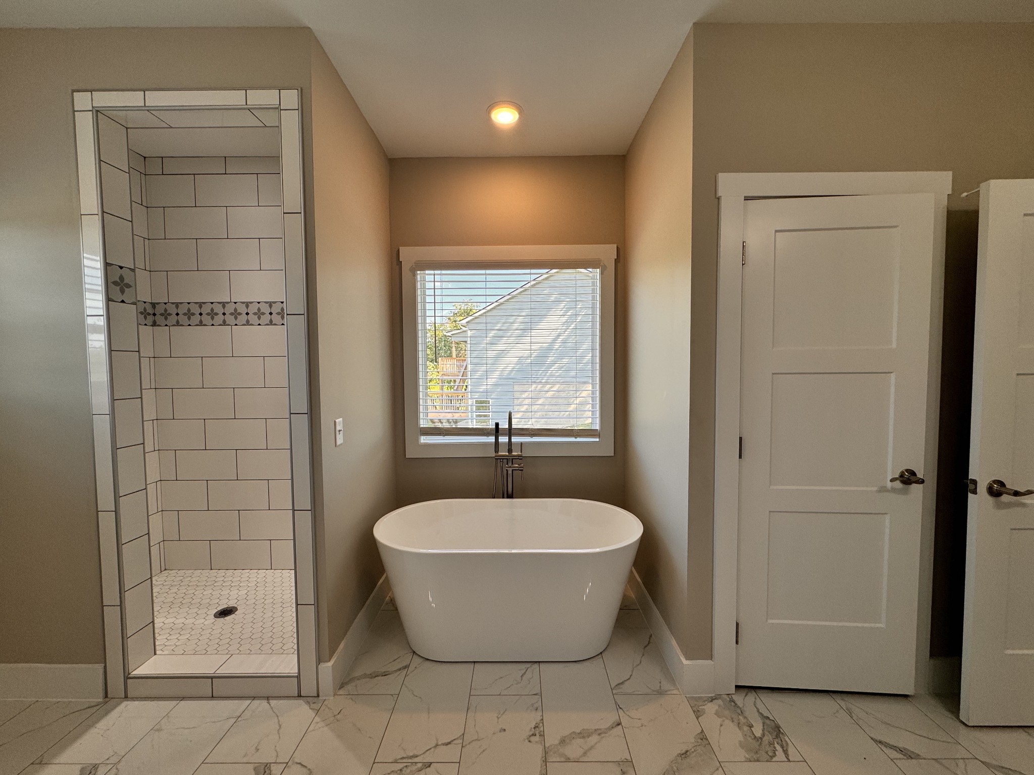 4595 Window Cliff Road Baxter, TN 38544 - Photo 16 of 30 a bathroom with a bathtub and shower