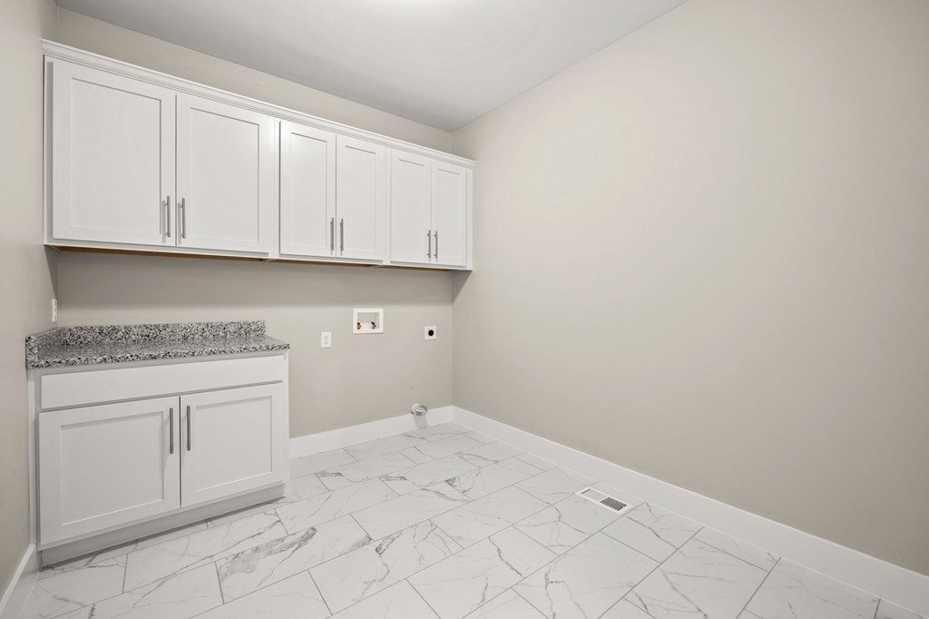 4595 Window Cliff Road Baxter, TN 38544 - Photo 19 of 30 a view of a kitchen with white cabinets