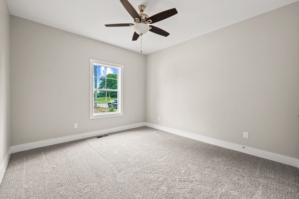 4595 Window Cliff Road Baxter, TN 38544 - Photo 20 of 30 an empty room with a window and a fan