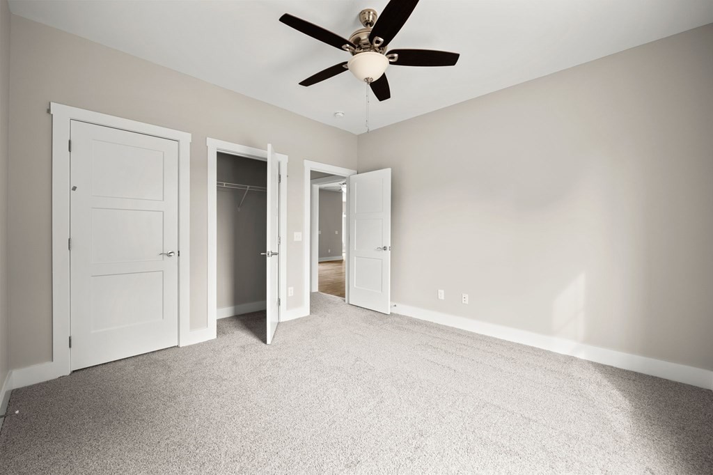 4595 Window Cliff Road Baxter, TN 38544 - Photo 21 of 30 an empty room with closet and windows