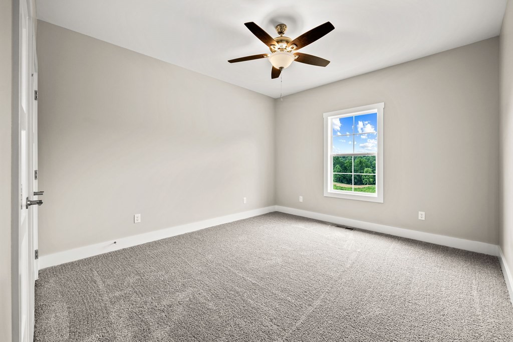 4595 Window Cliff Road Baxter, TN 38544 - Photo 22 of 30 an empty room with a window and a fan