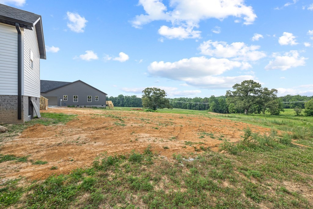 4595 Window Cliff Road Baxter, TN 38544 - Photo 27 of 30 a view of a lake with a yard
