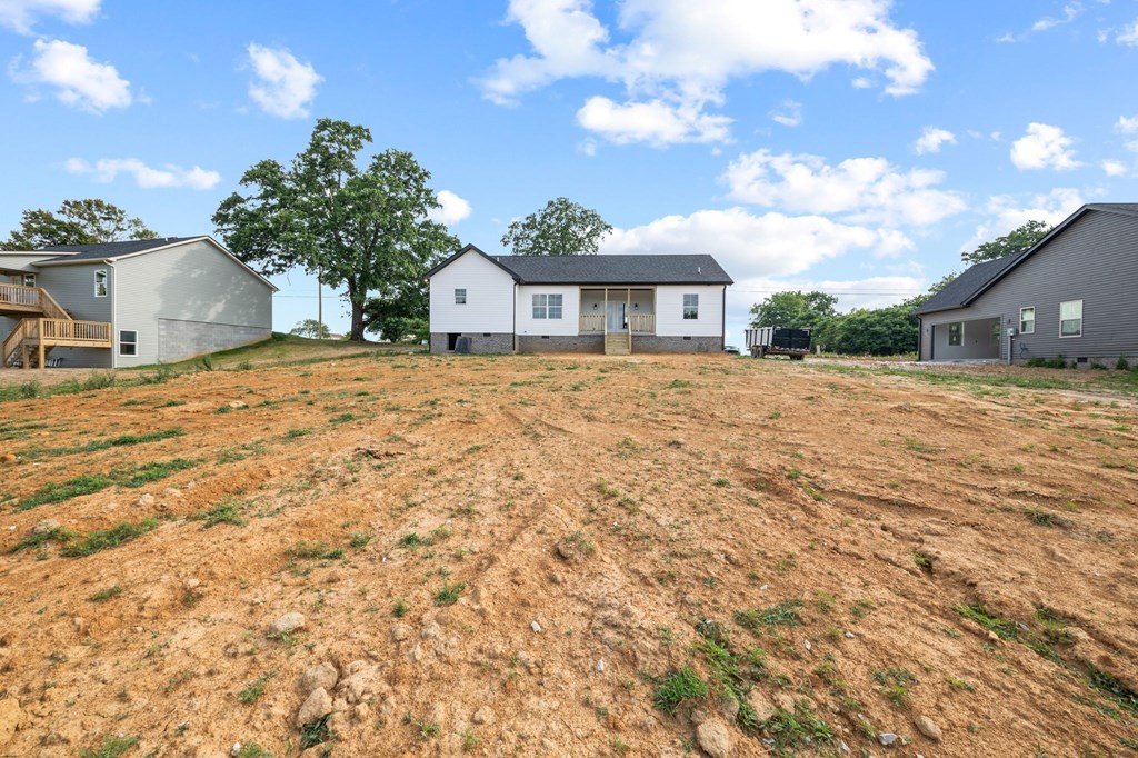 4595 Window Cliff Road Baxter, TN 38544 - Photo 28 of 30 a yellow house with a yard