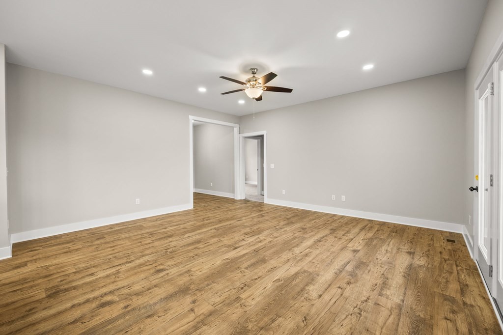 4595 Window Cliff Road Baxter, TN 38544 - Photo 9 of 30 wooden floor in an empty room with a window
