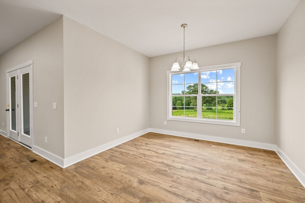 4595 Window Cliff Road Baxter, TN 38544 - Photo 10 of 30 a view of a room with window wooden floor and chandelier