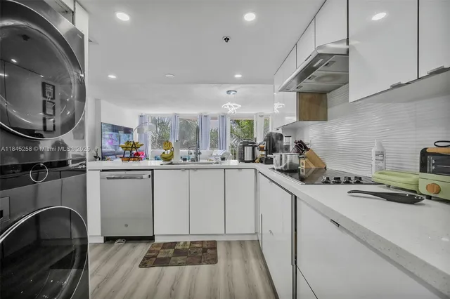 a kitchen with sink cabinets and stove