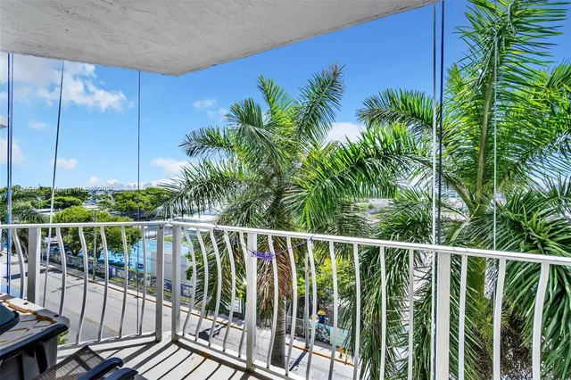 a view of a balcony with plants